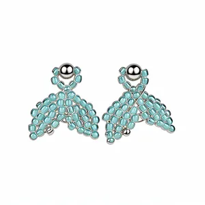 Elegant light blue rice bead mermaid tail stud earrings with a silver-toned finish