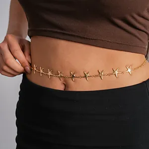 Close-up detail of a vintage gold metallic starfish belly chain worn around the waist