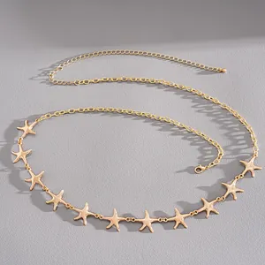 Detailed view of a gold-tone metal starfish chain belt with adjustable lobster clasp.
