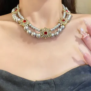 Detailed view of an elegant French vintage double-strand pearl necklace worn on neck