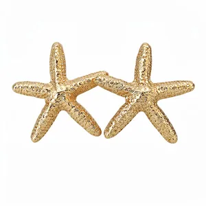 Elegant gold starfish stud earrings with a unique textured surface on white background