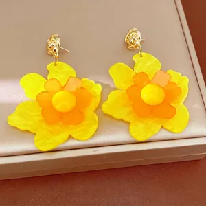 Elegant yellow resin flower stud earrings with silver needle for a sweet vacation look