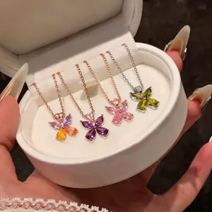 Exquisite butterfly pendant necklaces with colorful zircons displayed in a round white box