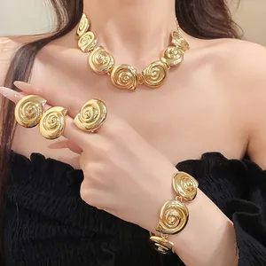 Golden vintage metal spiral conch jewelry set with necklace, bracelet, earrings and ring