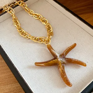 Vintage Maillard style brown acrylic starfish pendant necklace on golden chunky chain jewelry