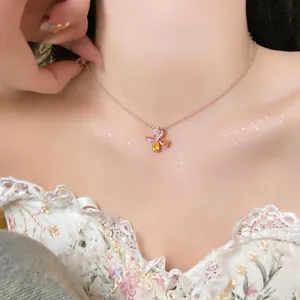 Detailed view of an elegant rose gold necklace with pink and yellow flower zircons