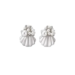 Elegant pearl stud earrings with seashell design for summer beach vacation style