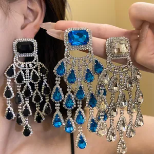 Detailed view of glamorous square crystal and teardrop tassel dangling earrings in three colors