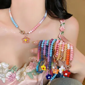 Detail view of colorful dopamine glass beaded flower necklaces in various sweet candy colors