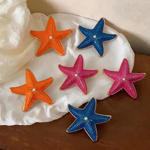 Vibrant starfish enamel stud earrings with pearl centers for beach vacation style