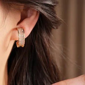 Gold-plated wide hoop ear cuff earring featuring pavé set clear cubic zirconia stones