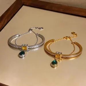 Elegant double-layer gold and silver bracelets with zircon stones and teardrop pendants
