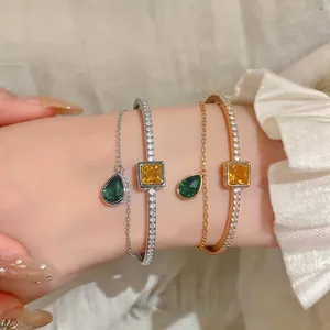 Elegant double layer gold and silver bracelets with square and teardrop zircon pendants