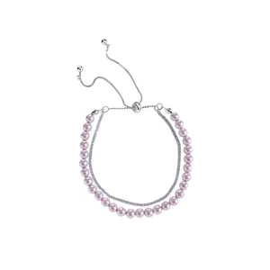 Elegant double-layered bracelet featuring pink pearls and sparkling zircon chain