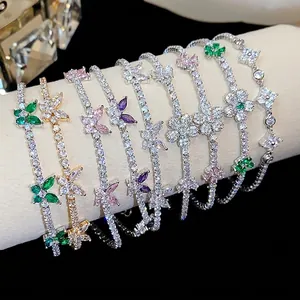 Elegant butterfly and floral zircon bracelets with colorful stones on a display stand