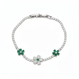 Silver-toned flower bracelet with sparkling clear and green emerald-style zircons