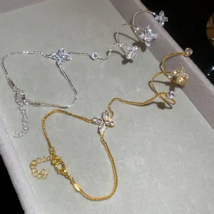 Macro view showing detail of elegant zircon flower hand chains in gold and silver