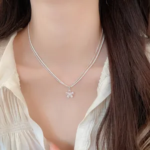 Sparkling zircon flower necklace on a model showing a sweet minimalist style