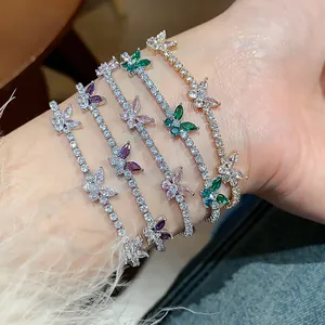 Detailed macro shot of four sparkling butterfly zircon bracelets in various colors