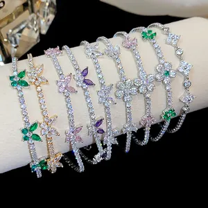 Close-up of sparkling zircon butterfly and flower bracelets on display