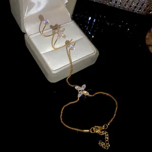 Close-up detail of the elegant gold-plated zircon flower integrated ring and bracelet set