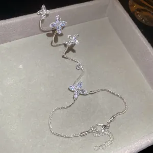 Close-up detail of elegant marquise zircon flower integrated ring hand chain bracelet
