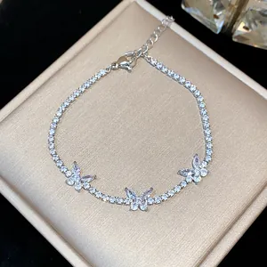 Close-up of elegant silver butterfly bracelet with sparkling zircon stones on gift box
