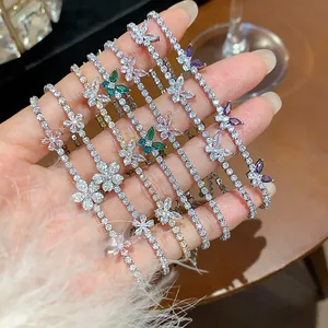 Close-up detail of luxury zircon butterfly tennis bracelets in various vibrant colors