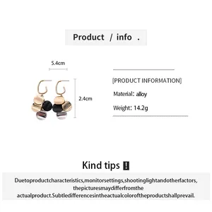 Metallic twisted disc dangle earrings with size and material specifications