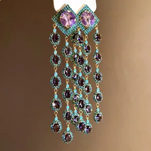 Vintage-style long tassel earrings featuring purple stones and turquoise borders for a classic look