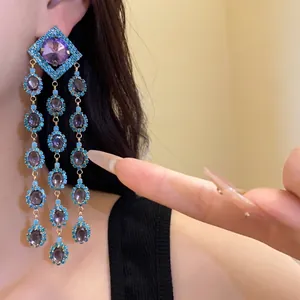 Vintage zircon diamond-shaped fringe earrings with purple crystals and turquoise accents.