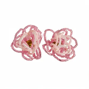 Elegant handmade pink glass bead flower stud earrings with silver needles for women.