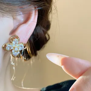 Exquisite 18k gold plated flower stud earrings with shimmering zircon and delicate pearls