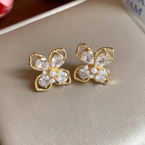 Exquisite 18k gold plated flower stud earrings featuring clear zirconia and pearls