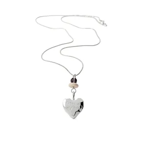 Elegant silver heart pendant necklace featuring Eternal my love engraving on white background