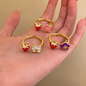 Adjustable gold flower and strawberry rings for women in vibrant dopamine style