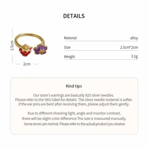Detailed view of the strawberry and flower ring showing material, size, and weight specs.