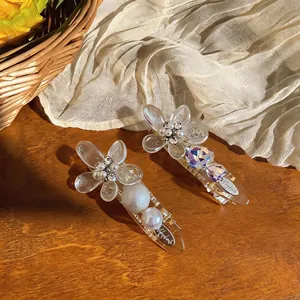 Elegant French style acrylic flower hair clips with pearls and rhinestones on wood