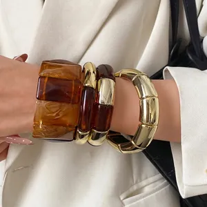Minimalist chunky amber acrylic and gold-tone metal spliced bangle bracelet for women
