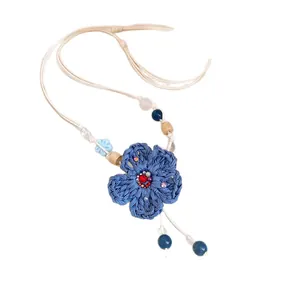 Handmade boho woven blue flower pendant necklace with leather cord and wooden beads