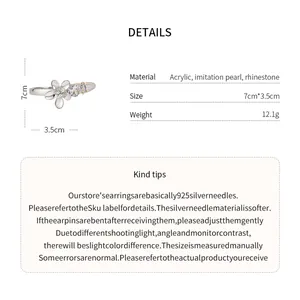 Detailed view of the elegant acrylic flower hair clip with pearl and rhinestone accents