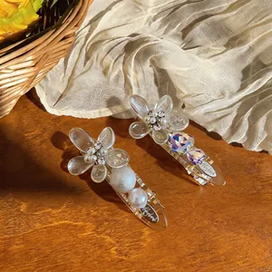 Exquisite detail view of French style acrylic flower hair clips with pearls and rhinestones