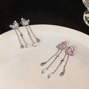 Elegant zircon butterfly stud earrings with pearl tassels in silver tone.