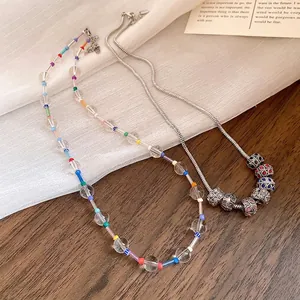 Bohemian crystal beaded necklace with colorful spacers and silver charm snake chain.
