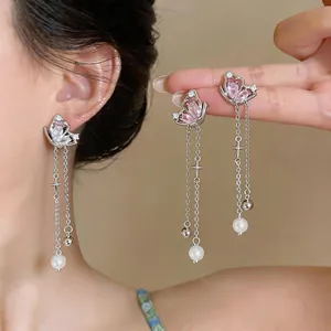 Elegant silver butterfly tassel earrings featuring zircon studs and delicate pearl drops.