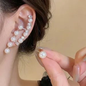 Elegant French vintage asymmetrical pearl earrings with silver needles and crystals