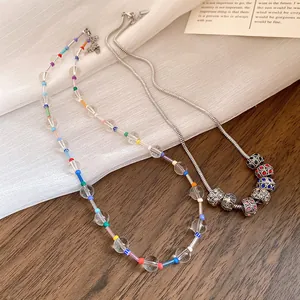 Detailed view of Bohemian crystal beaded necklace and silver snake chain with charms