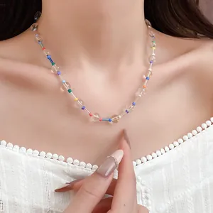 Detail view of bohemian crystal beaded necklace with colorful tube accents