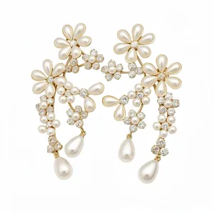 Vintage-style floral earrings with pearls and rhinestones on white background