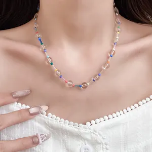 Detailed view of Bohemian crystal beaded necklace with multi-color beads on model neck